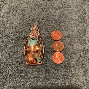 Handmade silver plated wire wrapped stone.
